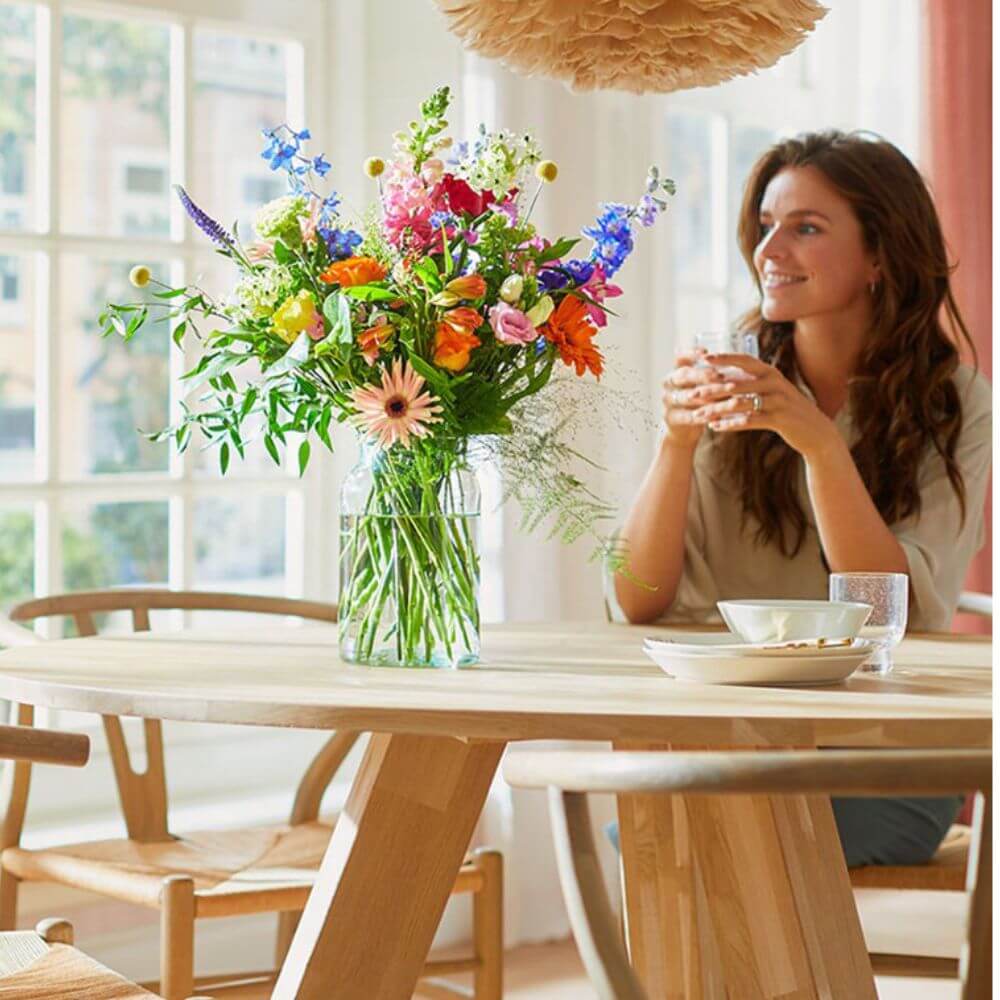 Woman enjoying a bouquet of flowers